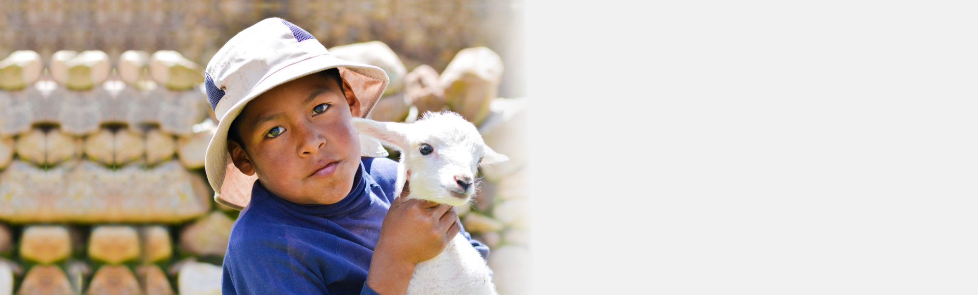 boy holding a goat